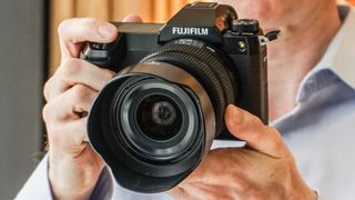 Fujifilm GFX50S II being held by Digital Camera editor Niall Hampton