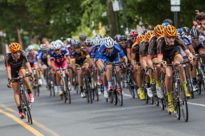 The Optum team gets stacked on the front on the final run into Manayunk