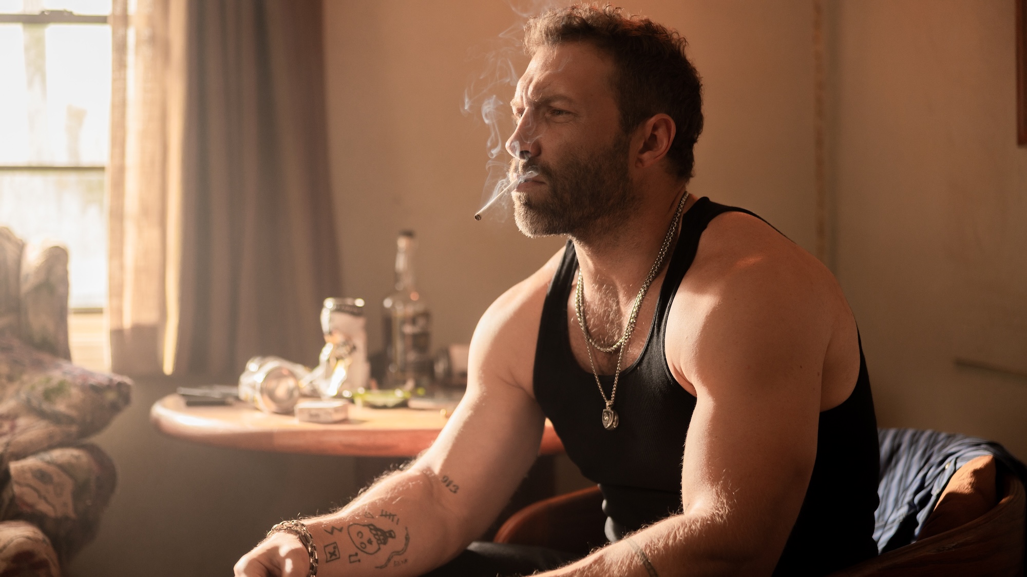Rob-Will smoking a cigarette holding a note in Dutton Ranch Season 1