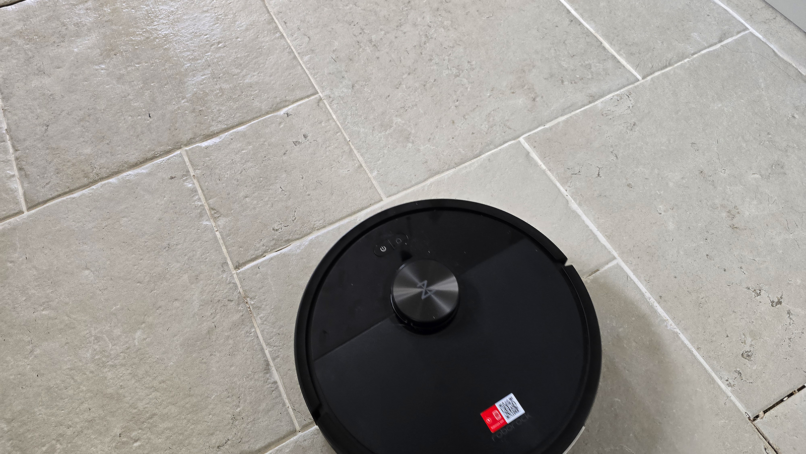 Roborock Q7 M5a mopping a stone floor
