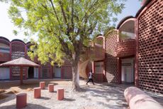 Tambacounda hospital overview exterior showing man walking in