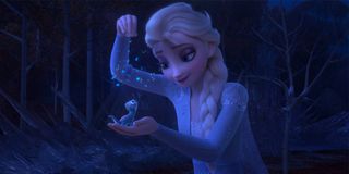 Elsa feeding the fire lizard in Frozen II