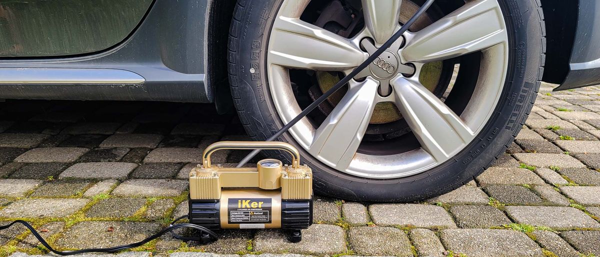 iKer Portable Air Compressor inflating car tire