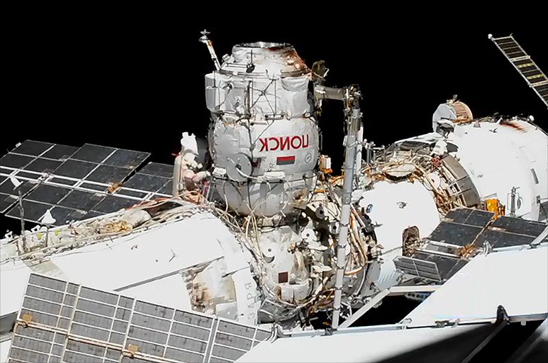 Cosmonaut Sergey Ryzhikov, Expedition 64 commander, is seen at the base of the Poisk mini-research module during a Nov. 18, 2020 spacewalk outside the International Space Station that inaugurated the use of Poisk as an airlock.