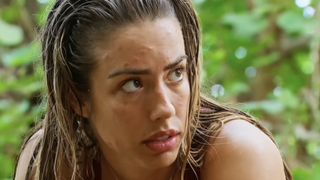 Dee Valladares talking intently on Survivor