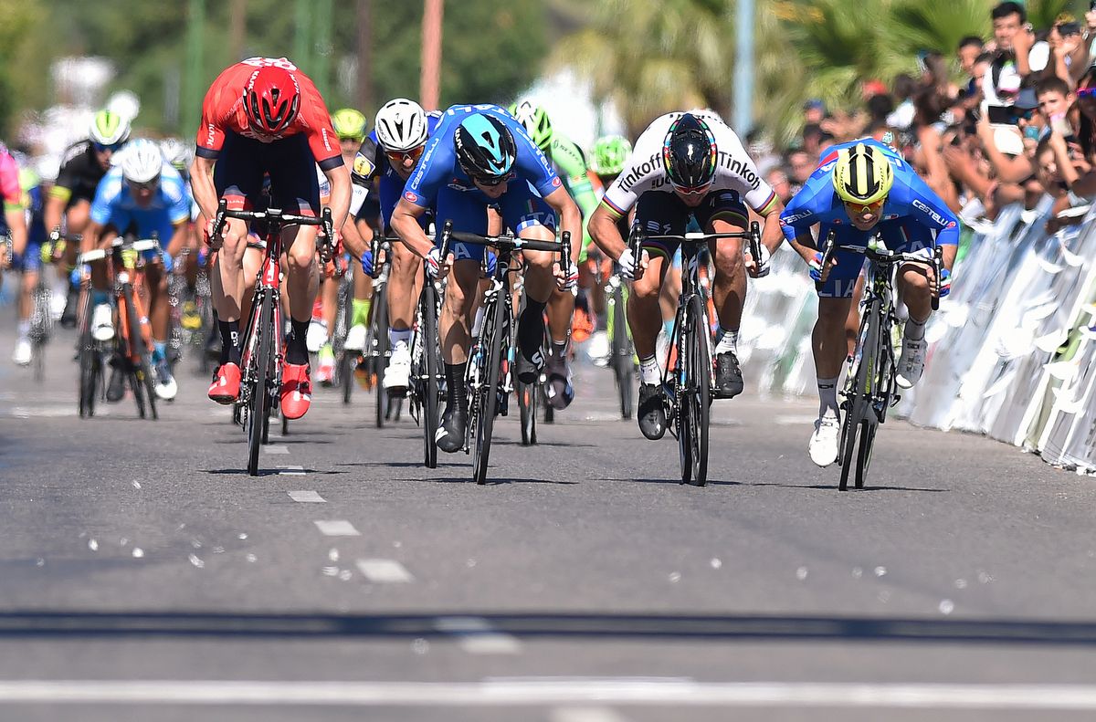 The four riders spread across the road