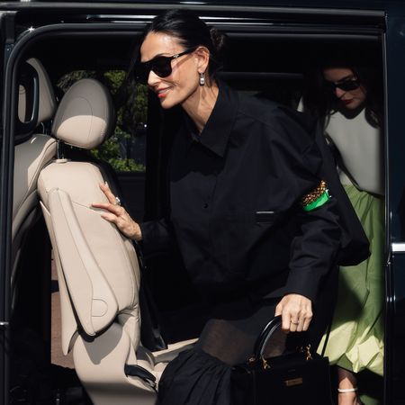 demi moore wears a balenciaga hourglass avenue bag.