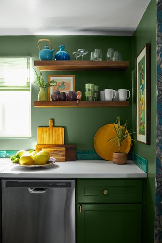 green kitchen walls with open shelving