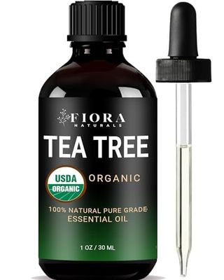 Black bottle with twist top on and pippette to the side with black to greed fade label that reads: Tea Tree Essential Oil by Fiora Naturals- 100% Pure Organic Oil 1 Oz /30ml