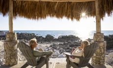 A mature couple on a beach in Mexico.