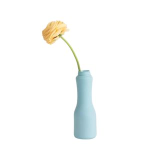 Blue vase with a flower in it from Urban Outfitters