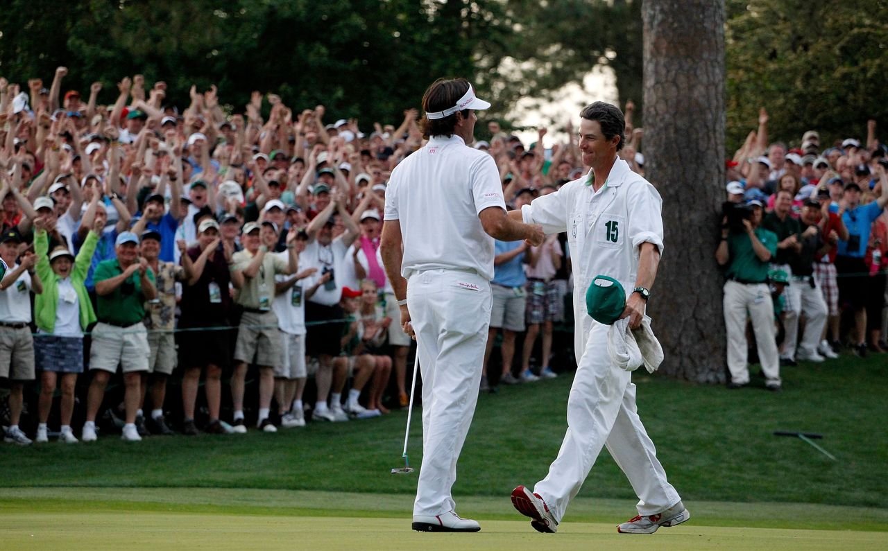 Ted Scott and Bubba Watson embrace after winning the 2012 Masters