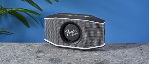 a retro inspired bluetooth speaker 8 inches long and 4 inches tall with a retro branded central circular woofer