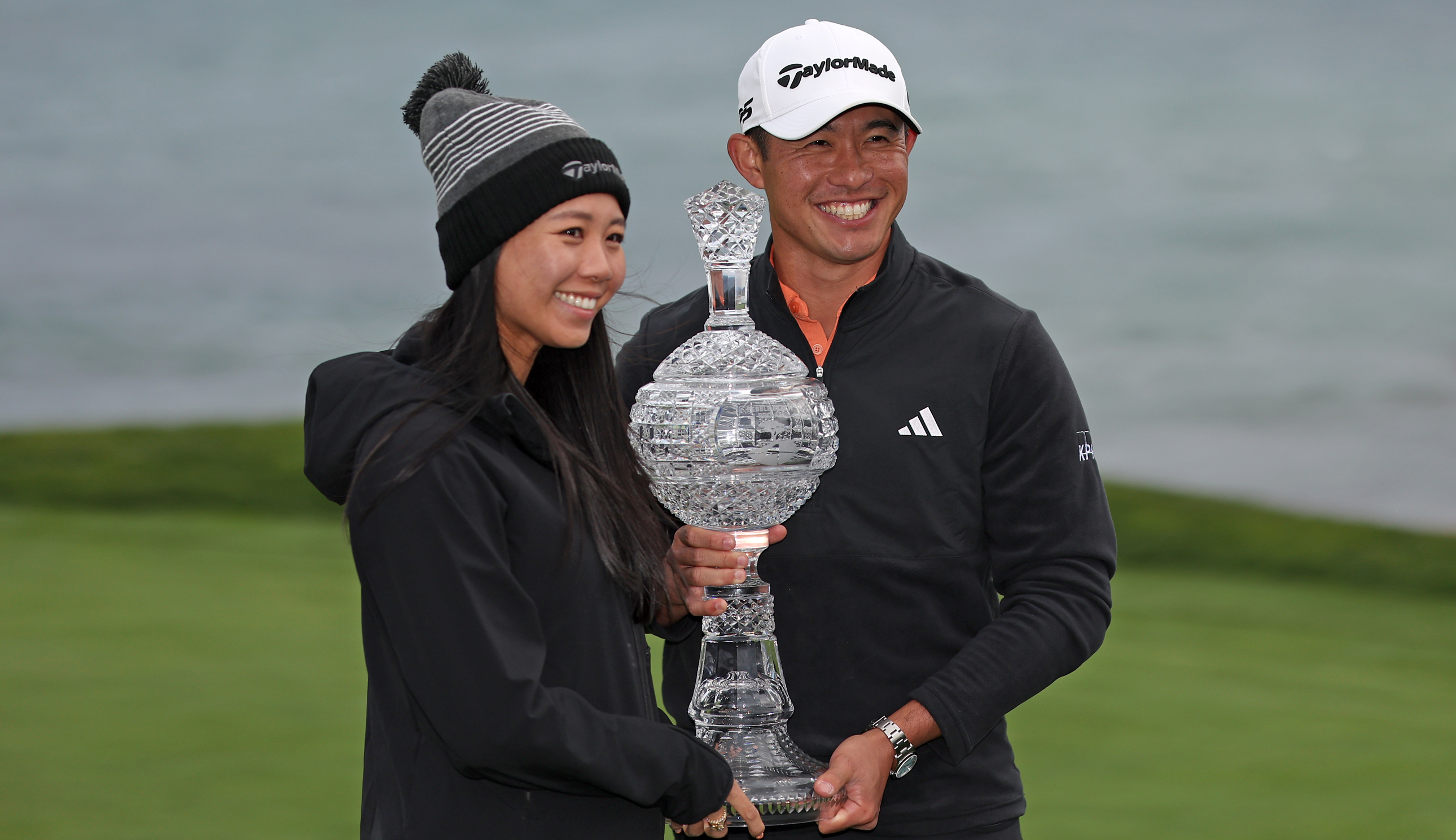 Collin Morikawa and his wife hold the AT&amp;amp;T Pebble Beach Pro-Am trophy