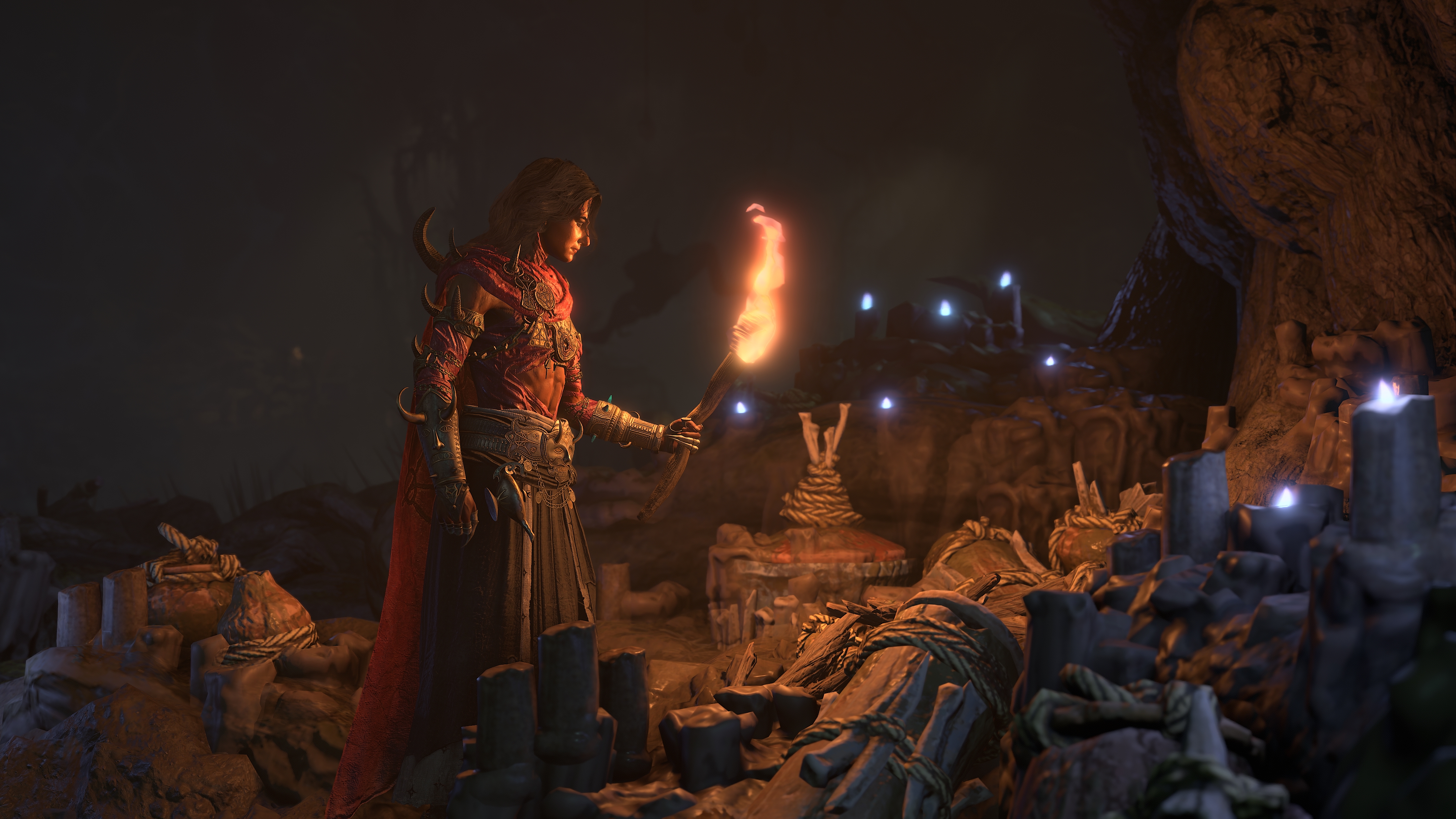 A screenshot from the Diablo 4: Lord of Hatred review build. A scene from a cutscene where the player character holds a torch as they are about to set something on fire.