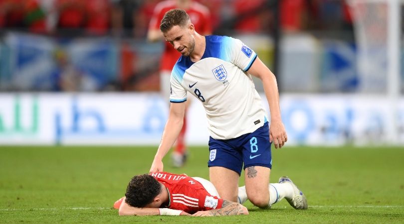 England midfielder Jordan Henderson checks on Wales&#039; Neco Williams after the full-back takes a blow to the head in the teams&#039; World Cup clash in Qatar.