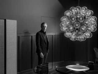 Daniel Lalonde, CEO of luxury interiors group Design Holding, photographed at the Milan showroom of B&B Italia, one of its nine brands, with a ‘Superloon’ floor lamp by Jasper Morrison for Flos
