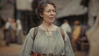 Olivia Colman standing outside in Wicker