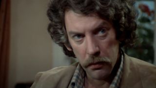 Close-up of Donald Sutherland's John Baxter in a church in Don't Look Now