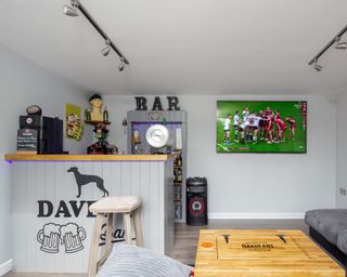 large garden room used as an outdoor bar and TV room