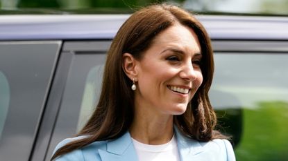 Catherine, Princess of Wales smiles during a walkabout meeting members of the public on the Long Walk near Windsor Castle in 2023