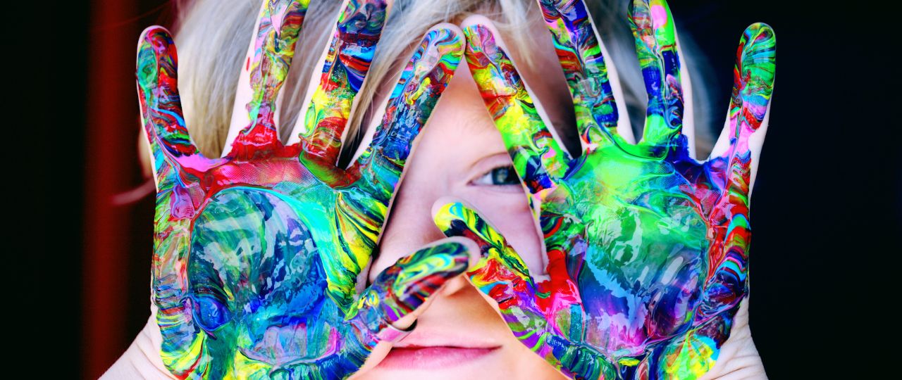 Image of child with paint on hands