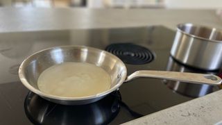 A pancake being cooked in the Made In 10-piece Stainless Steel Pan Set frying pan