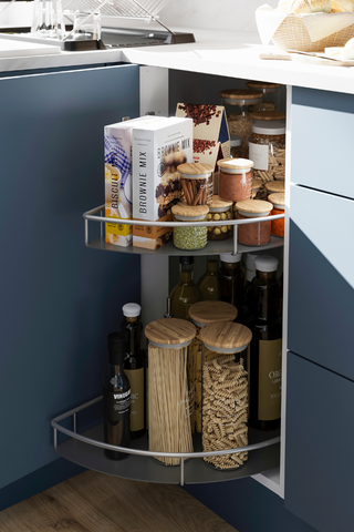 navy kitchen cabinet with lazy susan storage solution