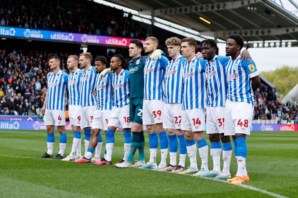 Huddersfield Town players gather to observe the national anthem before the Sky Bet Championship between Huddersfield Town and Reading at John Smith&#039;s Stadium on May 08, 2023 in Huddersfield, England. 