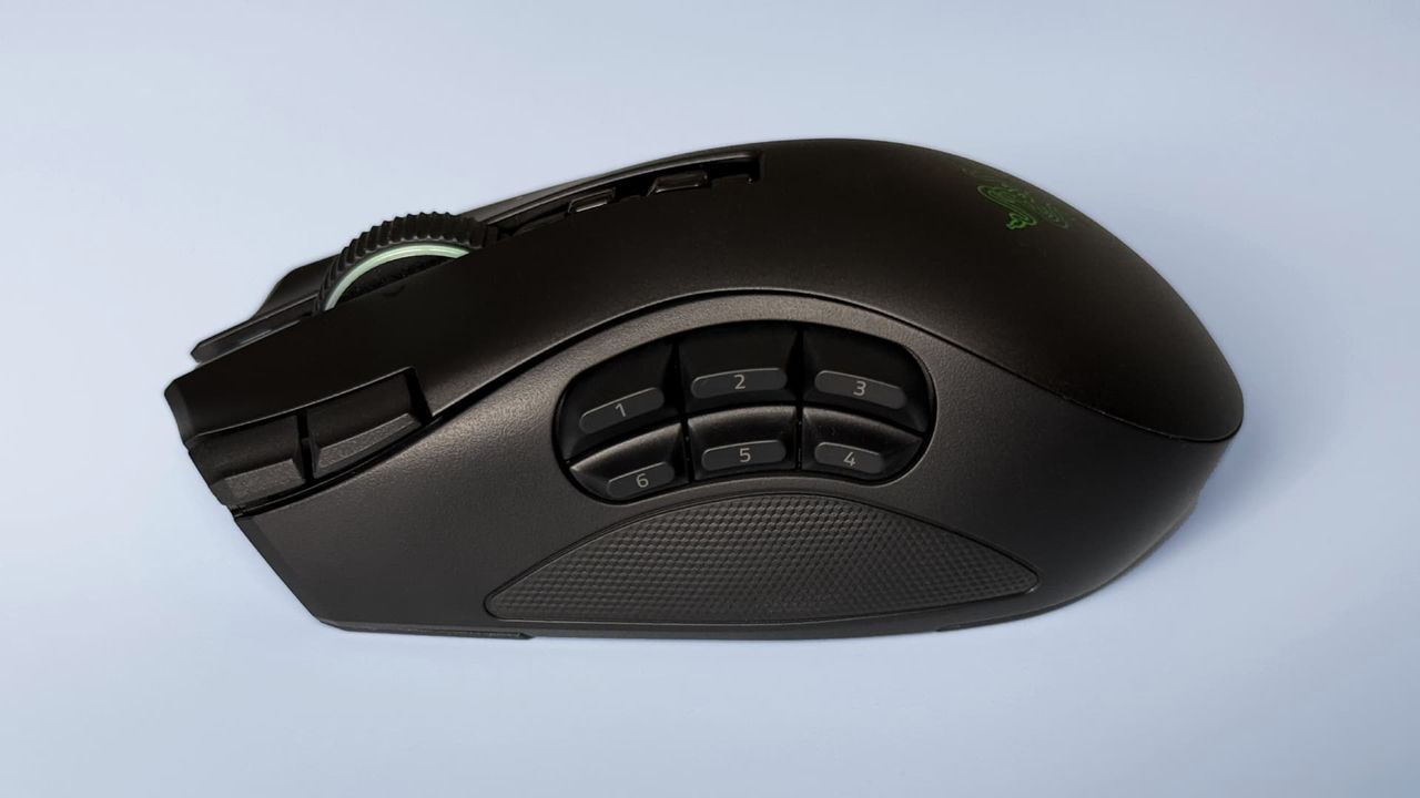 The Razer Naga V3 Pro mouse against a blue background.