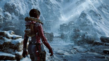 Lara Croft explores a snowy mountain in Tomb Raider: Legacy of Atlantis and walks towards a wooden bridge