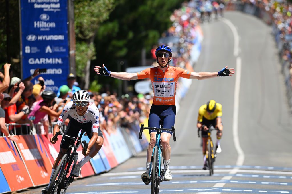 MOUNT LOFTY AUSTRALIA JANUARY 21 Stephen Williams of United Kingdom and Team Israel Premier Tech Orange Santos Leaders Jersey celebrates at finish line as stage winner ahead of Isaac Del Toro Romero of Mexico and UAE Team Emirates Lduring the 24th Santos Tour Down Under 2024 Stage 6 a 1282km stage from Unley to Mount Lofty 648m UCIWT on January 21 2024 in Mount Lofty Australia Photo by Tim de WaeleGetty Images