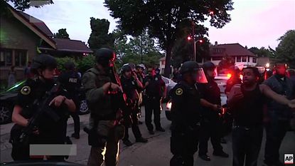 Milwaukee Police on the streets after two nights of violent unrest