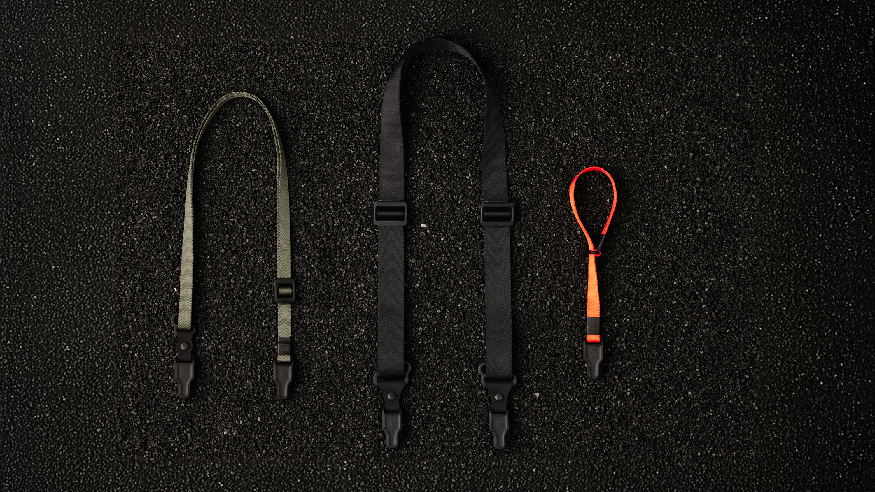 The Wandrd Magnetic Camera strap being used by a photographer