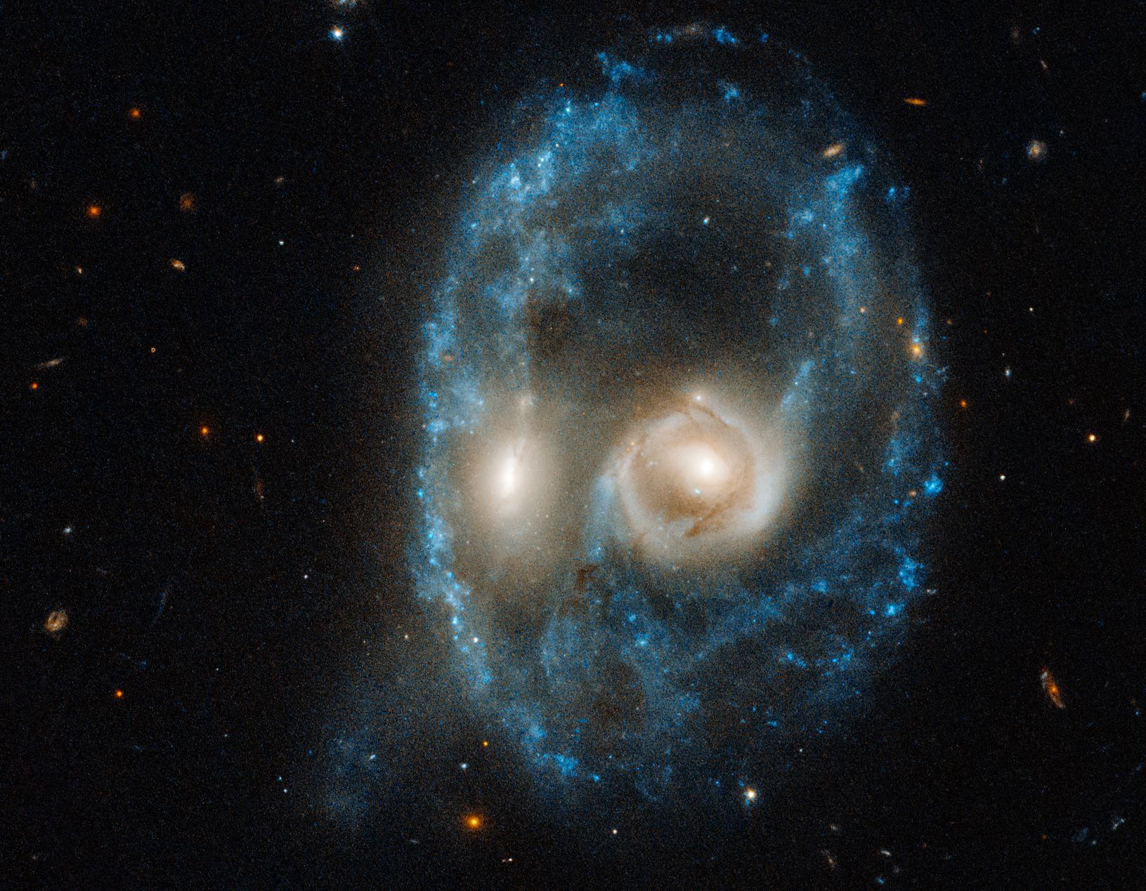 Galaxy Collision Creates “Space Triangle” in New Hubble Image 