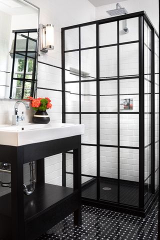 black and white bathroom with shower area with black crittall doors