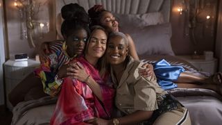 Shoniqua Shandai as Angie, Grace Byers as Quinn, Meagan Good as Camille and Jerrie Johnson as Tye all embraced in a hug in Harlem season 2