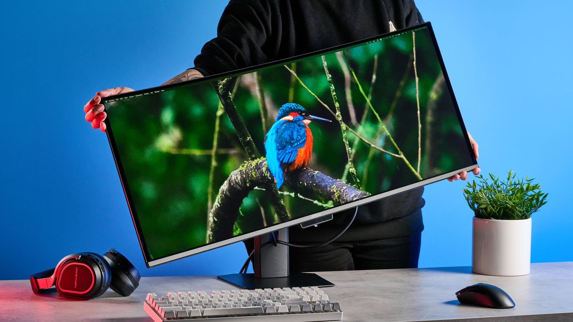 An MSI MPG 341CQR QD-OLED X36 gaming monitor in black