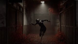 A monster standing in a hallway that's covered in Red Spider Lilies during the reveal trailer for Silent Hill f.