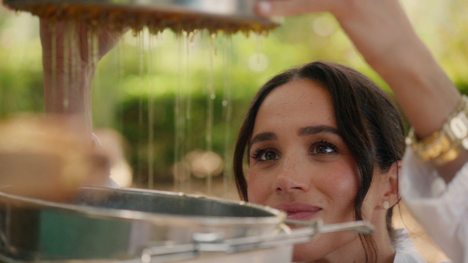 Meghan Sussex collects honey from her bees