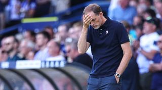 Thomas Tuchel holds his head during Chelsea's 3-0 loss to Leeds.