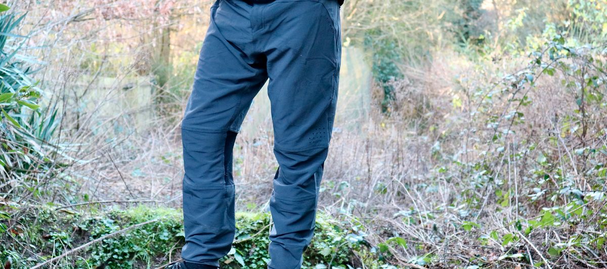 Madison Flux pants being worn in a garden