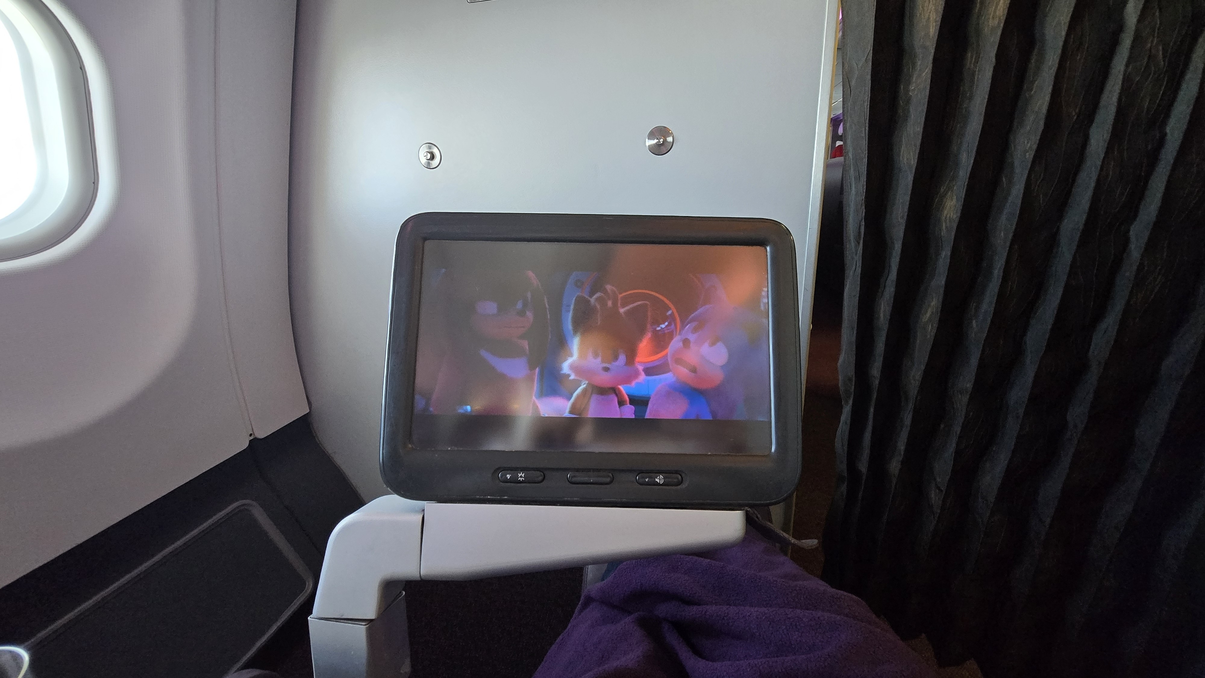 Sonic, Tails and Knuckles on an in-flight movie screen