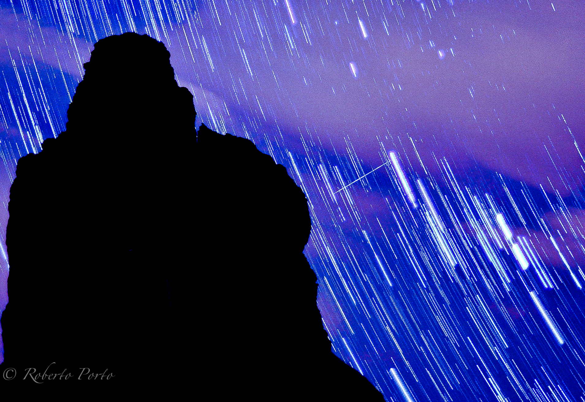 This long-exposure photo by Roberto Porto shows the bright arcs of star trails and a bright Quadrantid meteor in the predawn sky over Tenerife in Spain&#039;s Canary Islands.