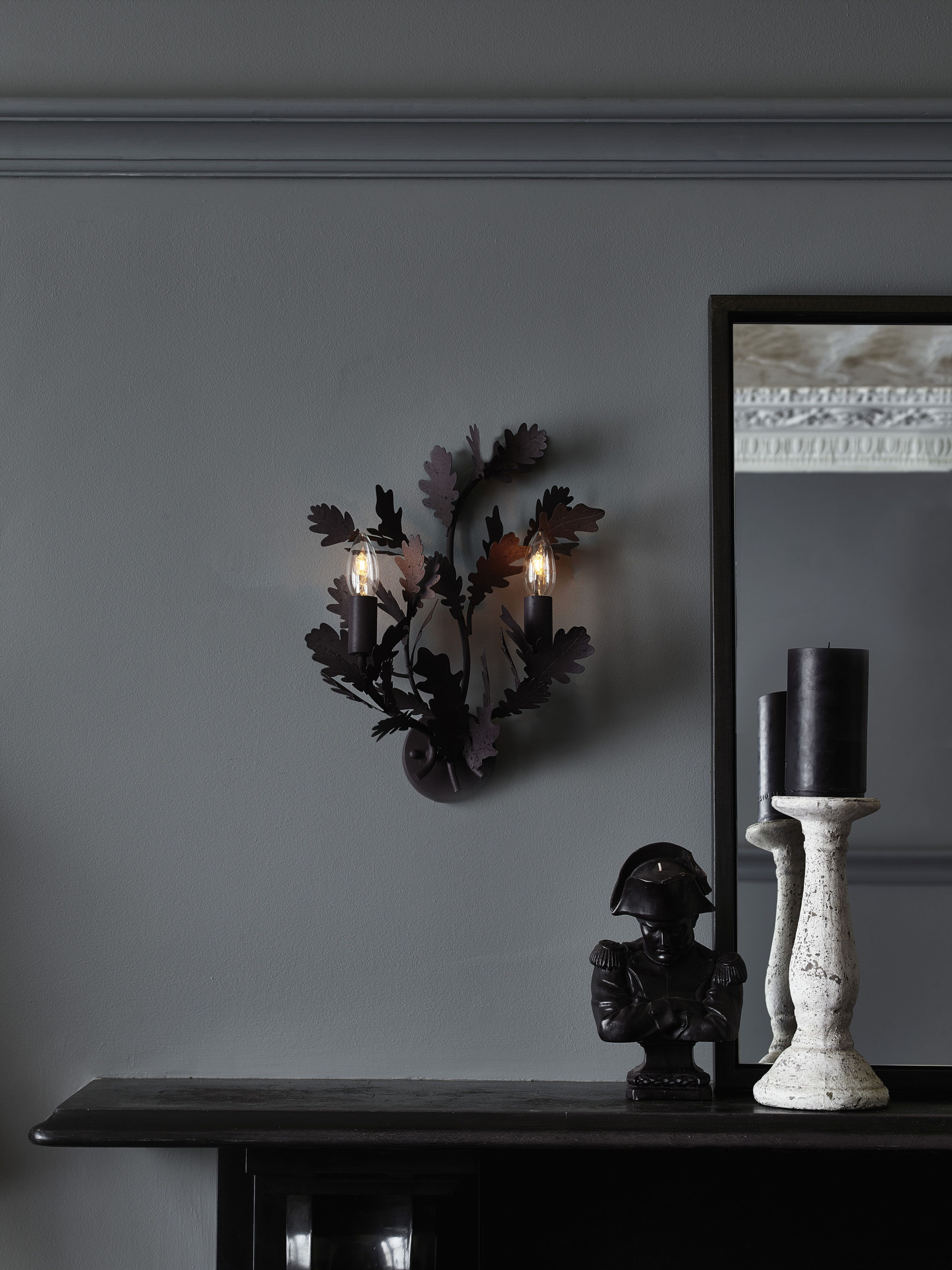 Ornate wall lighting in a traditional grey living room