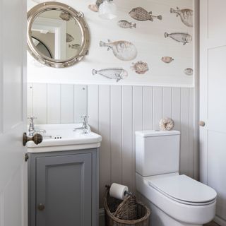 Downstairs cloakroom toilet with nautical theme and grey vanity unit