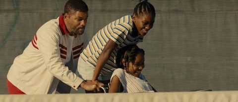 King Richard with daughters Serena and Venus Williams at tennis court