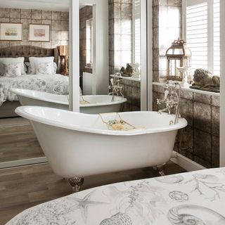 brown themed bedroom with bathtub