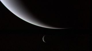 Voyager 2 looks back at Neptune (top) and Triton (bottom) in an image taken in August 1989.
