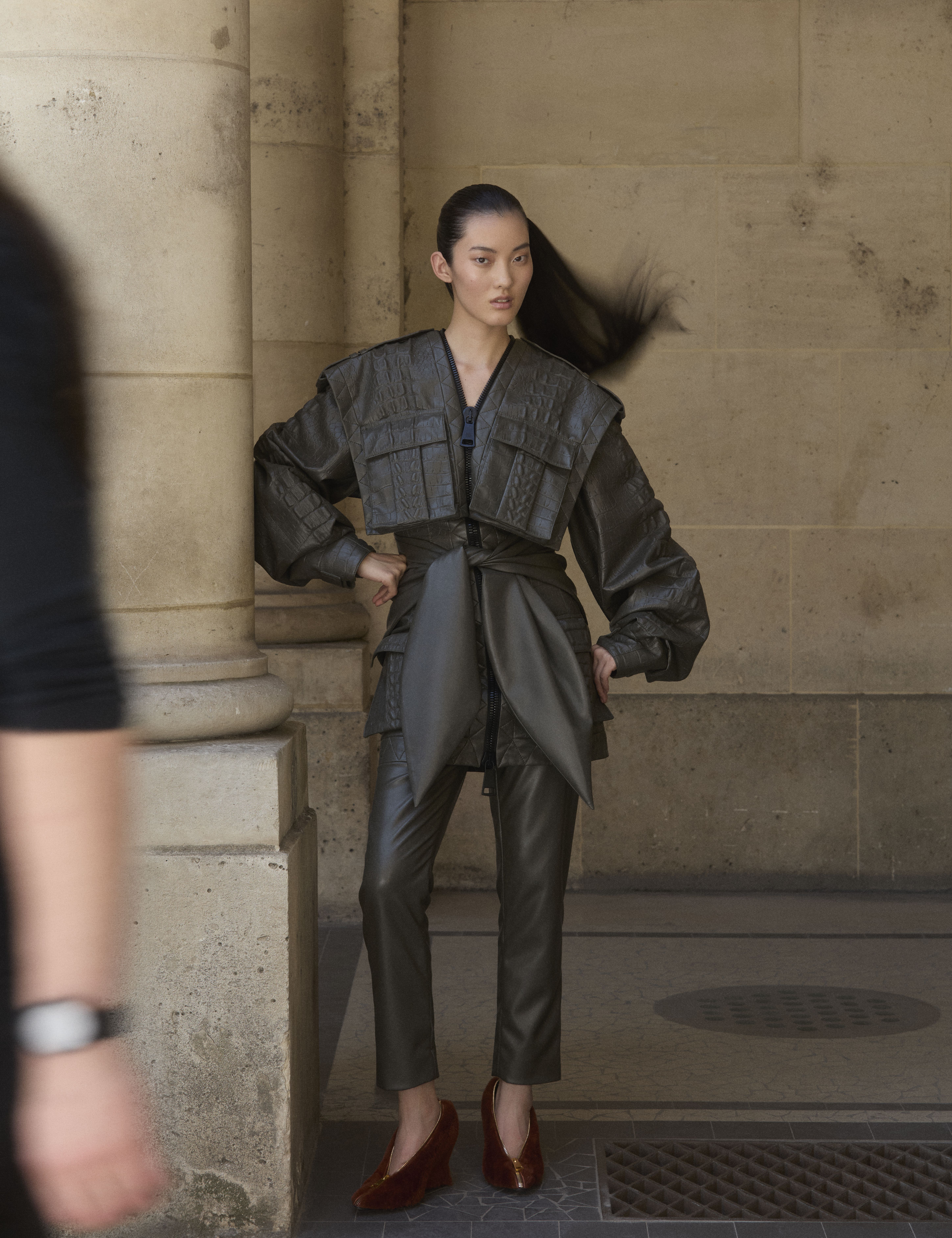 a model on the streets of paris wearing designs from the autumn/winter 2025 collections